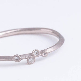 Spread four diamond platinum ring