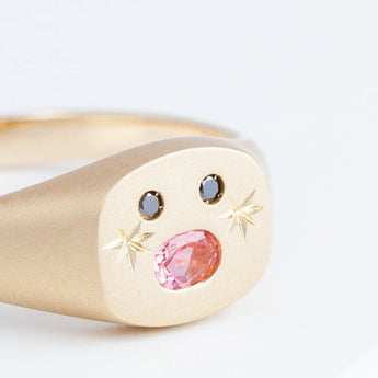Small oval mouth face signet ring with sparkly cheeks