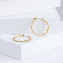 Load image into Gallery viewer, Tying hoop earrings with diamonds
