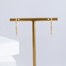 Load image into Gallery viewer, Tying hoop earrings with diamonds

