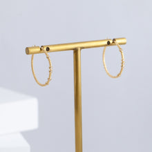 Load image into Gallery viewer, Tying hoop earrings with diamonds
