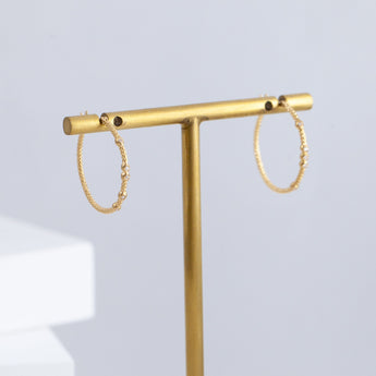 Tying hoop earrings with diamonds