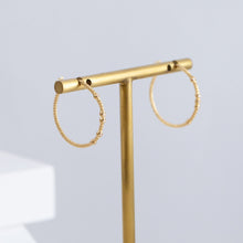 Load image into Gallery viewer, Tying hoop earrings with diamonds
