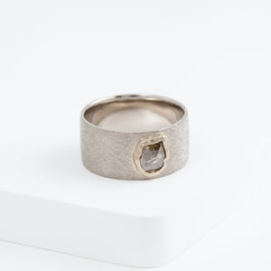 Flat white gold ring with unique brown diamond