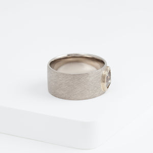 Flat white gold ring with unique brown diamond