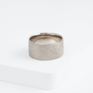 Flat white gold ring with unique brown diamond