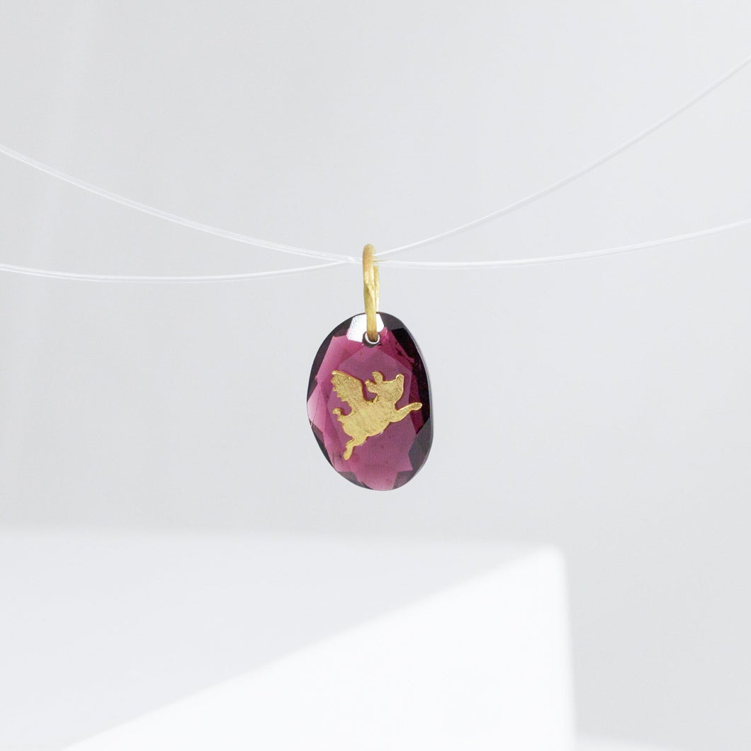 Flying pig garnet pendant