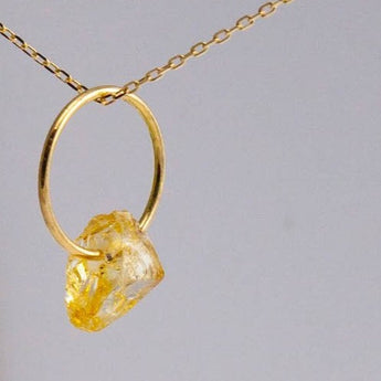 Rough stone gold grossular garnet pendant