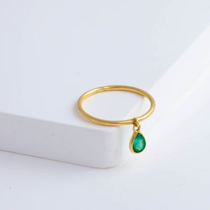 Swinging pear emerald ring