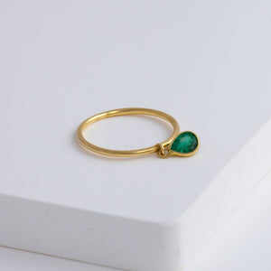 Swinging pear emerald ring